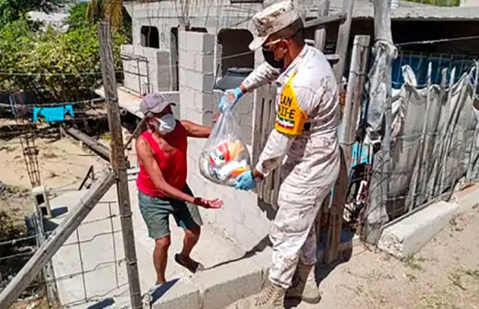Both soldiers and sicarios distribute care packages in Mexico.