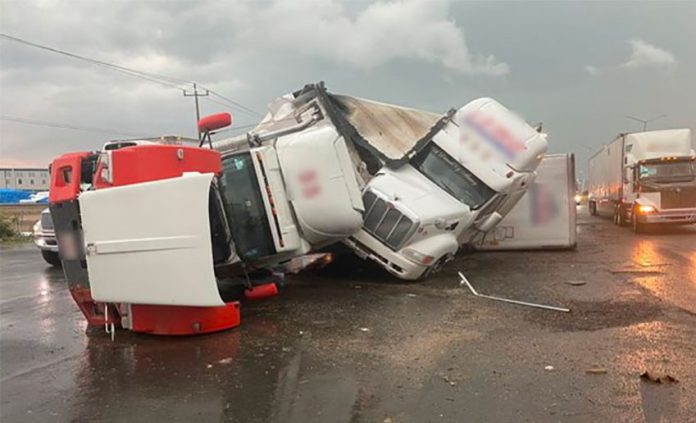 The wreckage of tractor-trailers after Friday's tornado.