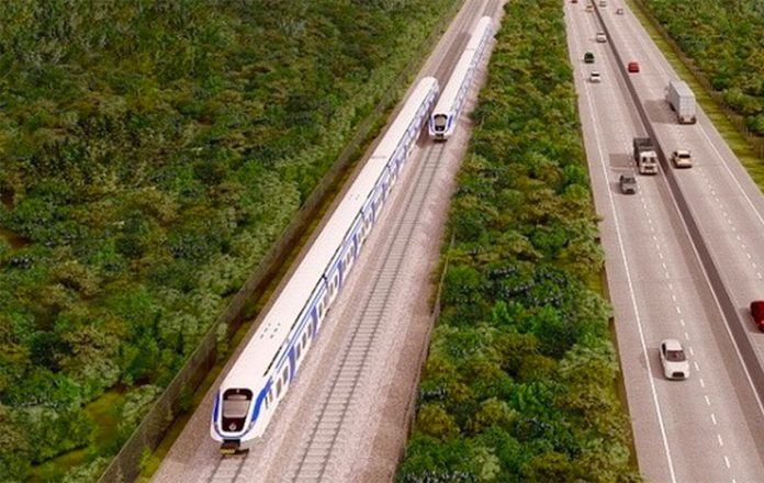 An artist's rendition of section four of the Maya Train, where it will run adjacent to the highway between Cancún and Izamal.