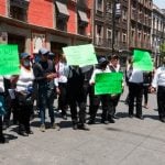 Unemployed waiters ask for economic support with a protest in Mexico City.
