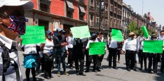 Unemployed waiters ask for economic support with a protest in Mexico City.