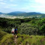 Hikers get a glimpse of Guadalajara while traversing the pine and oak forest.