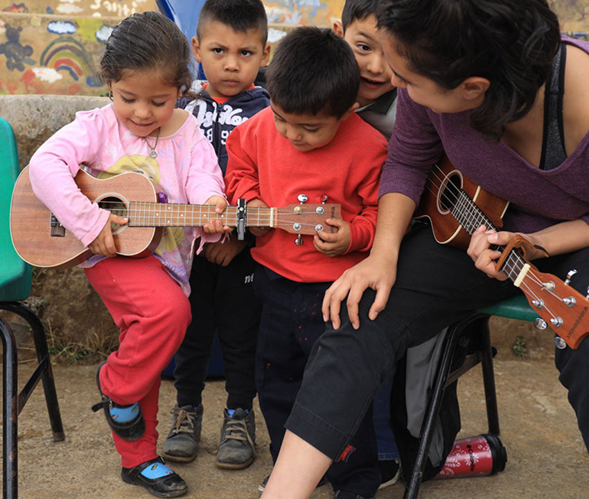Musician Lavinia Negrete with children in Valle de Bravo, México state.