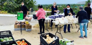 The Pescadero Food Bank prepares food packages for needy families.
