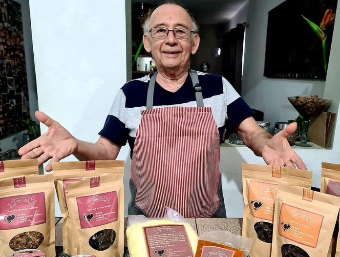 Tito Charly and some of his products.