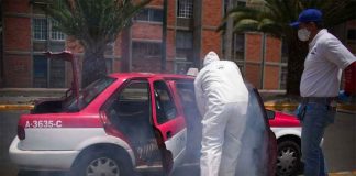 A taxi is disinfected against the coronavirus in Mexico City.
