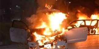 A vehicle burns after a clash between armed gangs in Sonora.