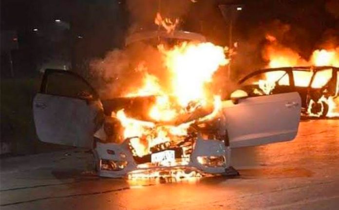 A vehicle burns after a clash between armed gangs in Sonora.