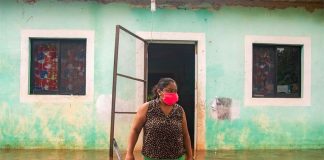 A woman surveys floodwaters in southeastern Mexico on the weekend.