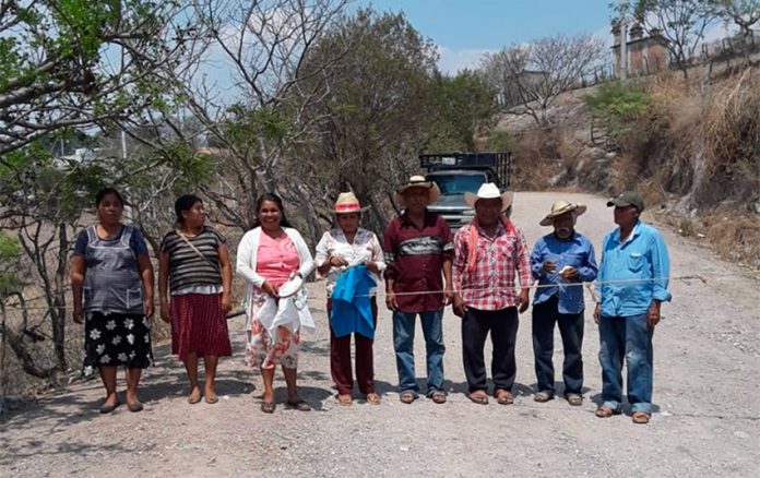 Citizens in Ahuacotzingo guard the entry to their village to control the coronavirus.