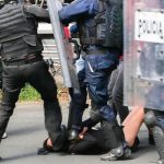 Police put their boots to a 16-year-girl in Mexico City.