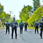Police guard the crime scene Friday in Mexico City.