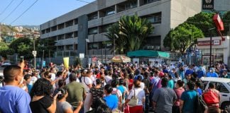 Workers protest unpaid bonuses Wednesday in Acapulco.