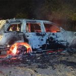 A car burns north of Culiacán where cartel hitmen have been fighting among themselves.