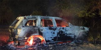 A car burns north of Culiacán where cartel hitmen have been fighting among themselves.