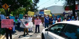 Medical workers in Mexico City protest aggression.