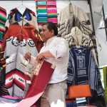 Armando Hernández sells textiles whose designs have been in his family for generations.