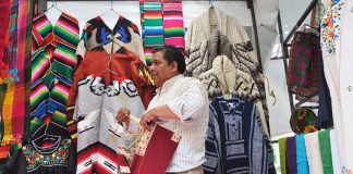 Armando Hernández sells textiles whose designs have been in his family for generations.
