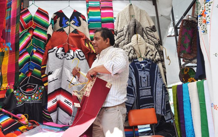 Armando Hernández sells textiles whose designs have been in his family for generations.