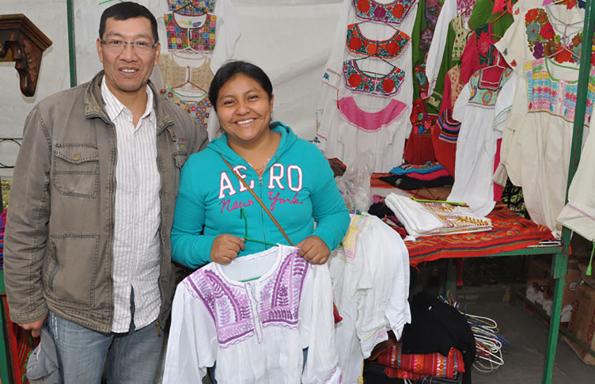 Garments sold by Agustín Girón and his wife Lucia reflect their Tzotzil Mayan roots.