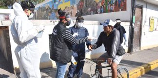 Health workers are attempting to convince more people to heed coronavirus warnings.