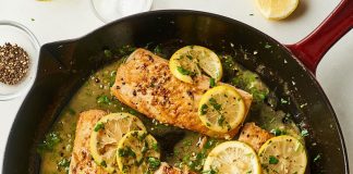 These garlic-lemon dorado fillets are seared in a hot pan.