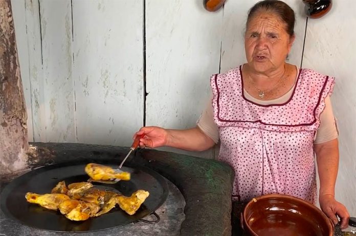 Doña Ángela in her rustic kitchen.