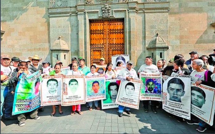 Family members of the missing students outside the National Palace in Mexico City.