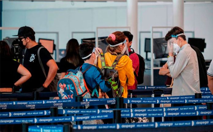 Travelers arriving in Cancún.