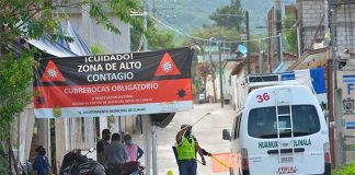 A van is sanitized upon entering town.