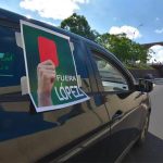 The president gets a soccer red card from this protester in Querétaro.