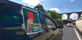 The president gets a soccer red card from this protester in Querétaro.