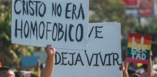 'Christ wasn't homophobic,' reads a placard during a gay rights march.