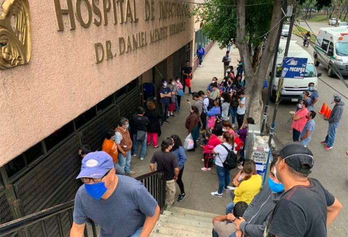 Family members wait outside La Raza National Medical Center in Mexico City for news about relatives inside.
