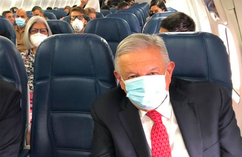 Another rare sight is AMLO with a face mask. 