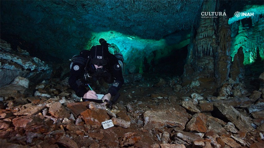 Diver Christophe Le Maillot examines evidence of mining activity.