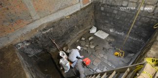 Archaeologists excavate and clean stone floor dating back to the early 16th century