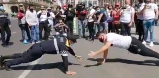 The officer and the fitness instructor at Friday's pushups challenge.