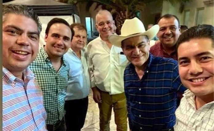 Coahuila Governor Riquelme, wearing hat, hosted a birthday party on Saturday.