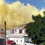 Yellow smoke above homes in Salamanca Thursday.