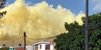 Yellow smoke above homes in Salamanca Thursday.