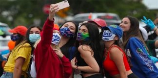 Healthy distances are difficult to maintain while taking group selfies.