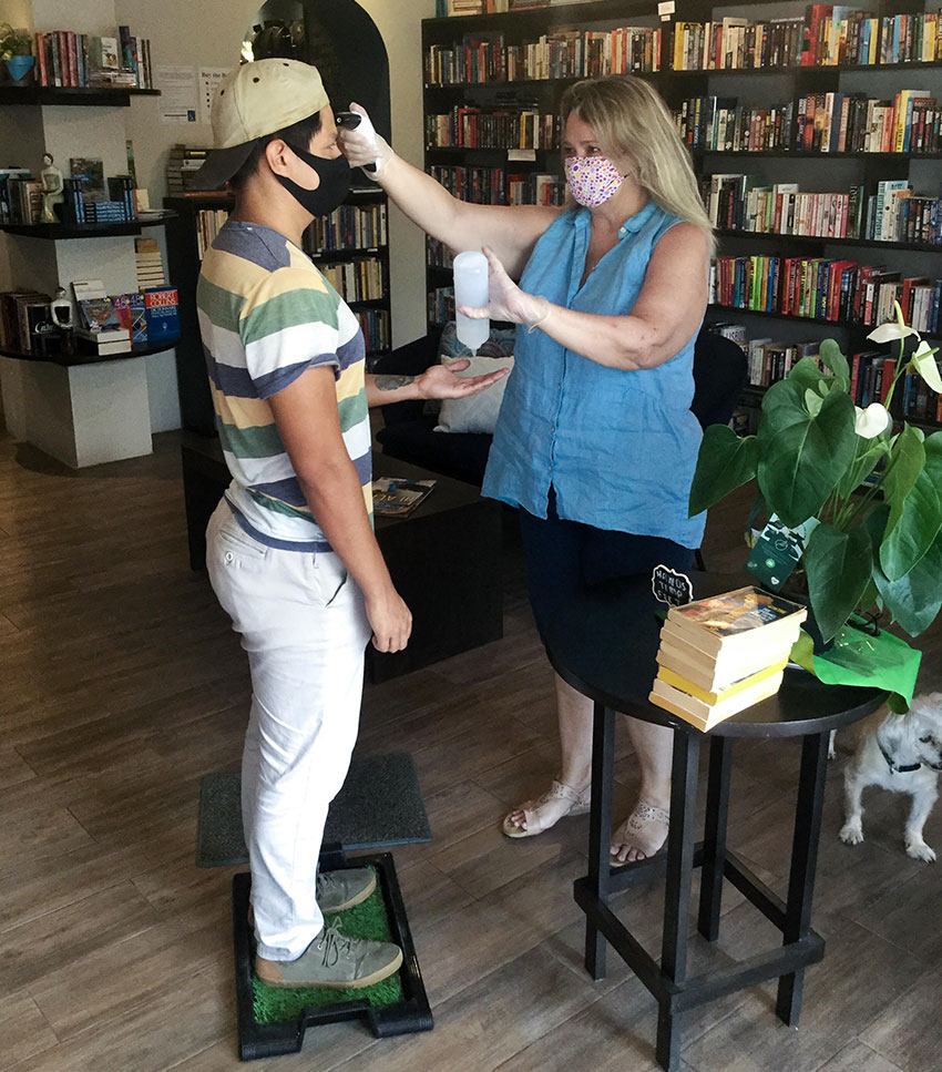 Kelly Casey welcomes a customer to her Puerto Vallarta bookstore and cafe.