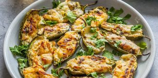 These baked jalapeños are stuffed with hard and cream cheese.