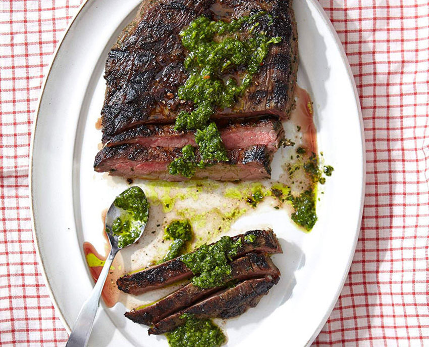 A steak topped with Argentinian chimichurri sauce.