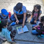A sidewalk class in session.