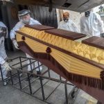 covid victim coffin