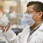 Castro and one of the hibiscus masks.