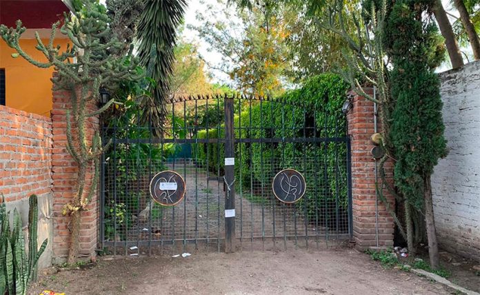The gates behind which El Marro was hidden when he was captured Sunday.