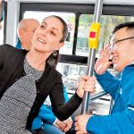 Mayor Sheinbaum takes a selfie with another Metro passenger.